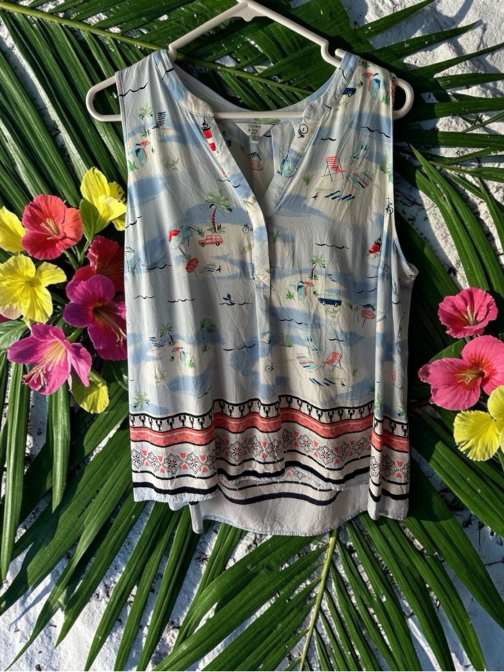 Crown & Ivy sleeveless top featuring a whimsical beach and nautical print
